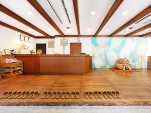 a large room with a lobby with a reception desk at Yubaraonsen Yubaranoyado Komeya in Maniwa +183 photos