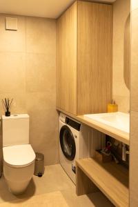 Koupelna v ubytování Wave 21 Nida Self Check-In Apartment