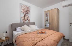 a bedroom with a bed with a tray on it at Villa Lemily with private pool by Villas Guide in Lipa +23 photos