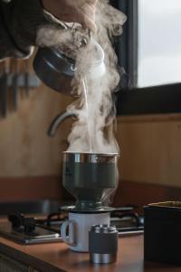 a person is mixing something in a food mixer at Ascella in Llanrwst