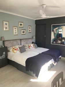 a bedroom with a large bed in a room at Constantia Lazy River in Cape Town +71 photos