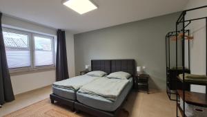 Ένα ή περισσότερα κρεβάτια σε δωμάτιο στο Gästehaus Ferienwohnung Zimmer 2A Jülich