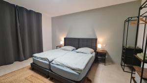 Ένα ή περισσότερα κρεβάτια σε δωμάτιο στο Gästehaus Ferienwohnung Zimmer 2A Jülich