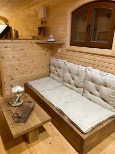 a bench in a sauna in a wooden room at La champ être in Neuville-sur-Sarthe