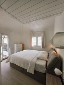 a bedroom with a large bed and a window at Charming family villa in Geneva