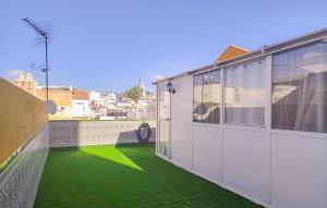 a balcony with green grass on a building at 3 Bedroom Gorgeous Apartment In Malaga in Málaga +10 photos