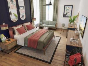 a bedroom with a large bed and a living room at MK Colombo in Colombo