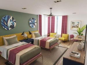 a bedroom with two beds and a living room at MK Colombo in Colombo