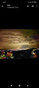 a view of a cloudy sky with a city at Kasauli Residency in Kasauli +7 photos