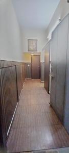 an empty hallway of a building with doors and a corridor at Kasauli Residency in Kasauli