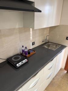 Kuchyň nebo kuchyňský kout v ubytování Homely Heaven