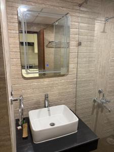 Koupelna v ubytování Homely Heaven + 6 fotografií