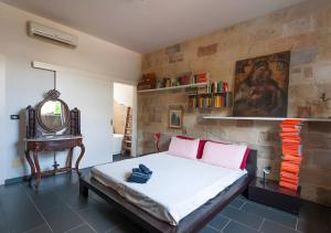 Ένα ή περισσότερα κρεβάτια σε δωμάτιο στο Masseria il Fondone Rooms +46 φωτογραφίες