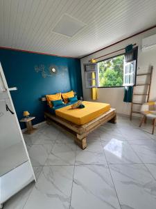 Postel nebo postele na pokoji v ubytování La villa aux 4 palmiers