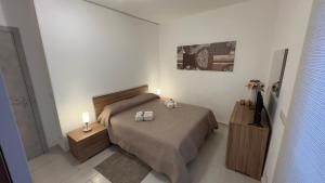 Una cama o camas en una habitación de Vito's House