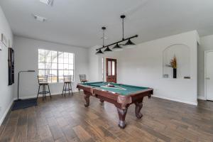 a living room with a pool table in it at Fabulous & Stylish 4BR w Pool Table and Space to Chill in Houston
