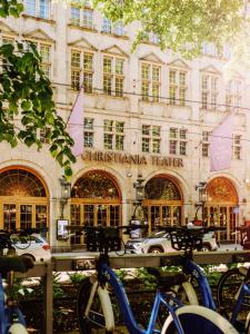 a group of bikes parked in front of a building at Hotel Christiania Teater in Oslo