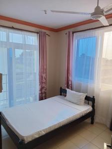 Ένα ή περισσότερα κρεβάτια σε δωμάτιο στο Mtwapa Luxury Apartment with Pool B1M +12 φωτογραφίες