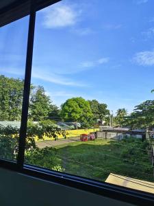 a view of a park from a window at PA L Residence in Euscara