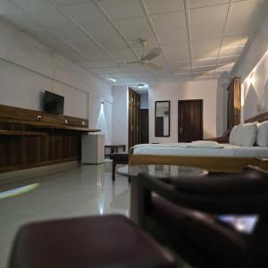 TV a/nebo společenská místnost v ubytování Whispering Palms Resort + 1 fotografie