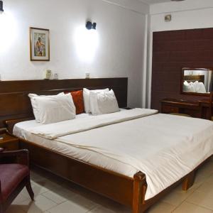 Postel nebo postele na pokoji v ubytování Whispering Palms Resort