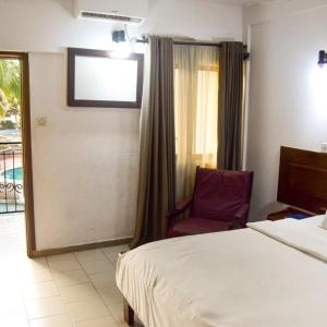 Postel nebo postele na pokoji v ubytování Whispering Palms Resort