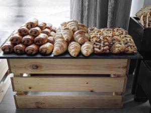 a bunch of donuts sitting on top of a table at Sand Hotel by Keahotels in Reykjavík