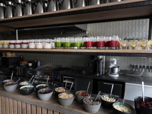 a kitchen with bowls of food on a shelf at Sand Hotel by Keahotels in Reykjavík