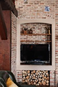 Μια τηλεόραση ή/και κέντρο ψυχαγωγίας στο Vakantiewoning Welle Weg