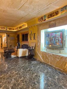 a room with a stone wall with a painting on the wall at Pyramids Mystery Inn in Cairo +46 photos