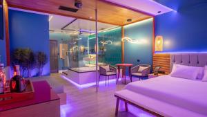 Ένα ή περισσότερα κρεβάτια σε δωμάτιο στο Liv Motel Ecuador