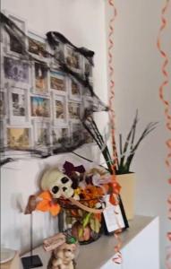 a shelf with a bunch of stuffed animals on it at Apartament Crooked stairs in Zielona Góra