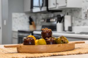 a wooden bowl of vegetables on a counter in a kitchen at Great Escape Duo in Branson