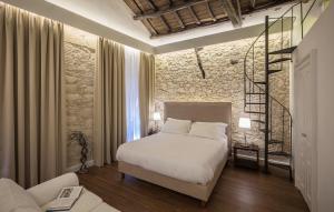 A bed or beds in a room at Arcipelago 41 Még 32 kép