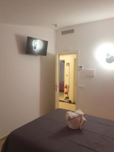 Postel nebo postele na pokoji v ubytování Albergo Flaminia Rooms + 6 fotografií