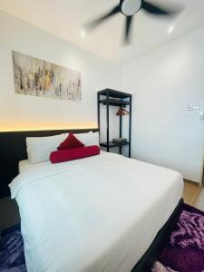 a bedroom with a white bed with a ceiling fan at Rooma Kichi Private Pool in Pantai Cenang