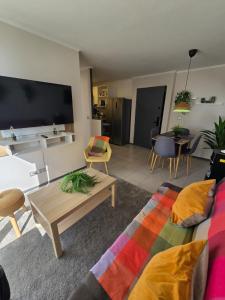 a living room with a couch and a table at Cálido -moderno - céntrico - acogedor - in Rancagua