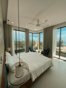 Ένα ή περισσότερα κρεβάτια σε δωμάτιο στο Gió và Cát Cafe & Homestay