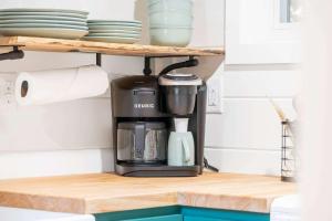 a coffee maker on a shelf in a kitchen at Cedar Creek - Glamping in the Ozarks in Walnut Shade