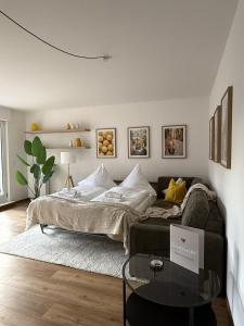 a living room with a couch and a table at Apartmenthaus Gilden 7 in Borken