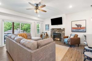 a living room with a couch and a fireplace at New Lakeside Haven - Picturesque in Branson
