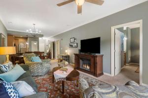 a living room with a couch and a fireplace at Blue Heron Hideaway - Table Rock Lake in Branson
