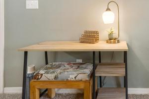 a table with a bench under it with a lamp at Blue Heron Hideaway - Table Rock Lake in Branson +21 photos