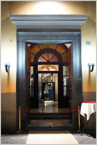 an entrance to a building with a red ribbon around it at Hotel Villa Nunziante Pompei in Scafati