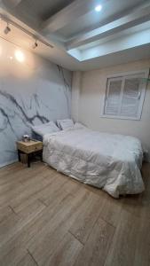 a bedroom with a bed and a table in it at 연 스테이 in Seoul +52 photos