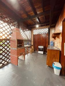 a kitchen with a brick oven in a room at Casa de Praia Tribo de Judá in Bragança