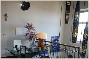 a living room with a table and a window at Hotel Villa Nunziante Pompei in Scafati
