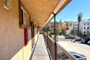 a balcony of a building with a red door at Travel Inn Downtown LA in Los Angeles