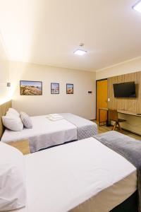 Ένα ή περισσότερα κρεβάτια σε δωμάτιο στο Estalagem Portucale