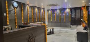 a lobby with a reception desk and a clock on the wall at Hotel Rani Palace at Lake Fatehsagar in Udaipur +45 photos